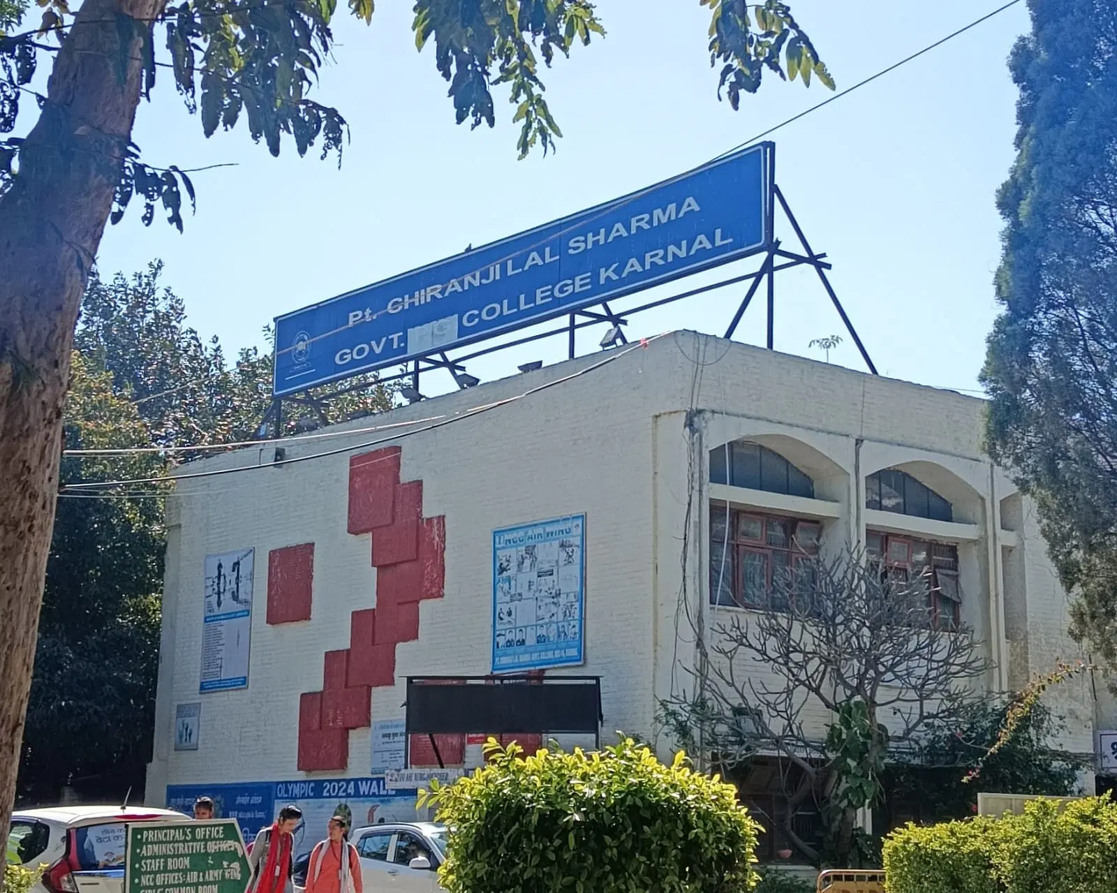 Campus view of Pandit Chiranji Lal Government College showing modern buildings and green spaces